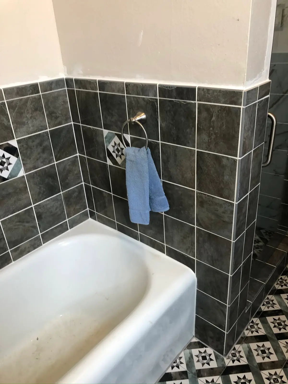 Interior painting in Vallejo: bathroom walls painted above dark tile