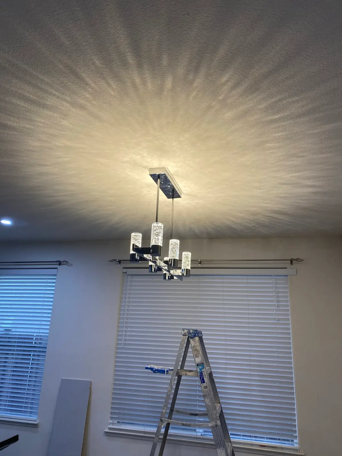 Electrician in Vallejo: modern chandelier installed on a textured ceiling