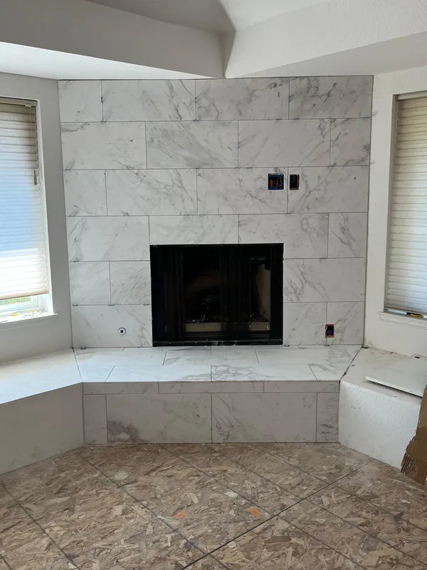 Marble-look tile fireplace with a raised hearth in a Vallejo remodel