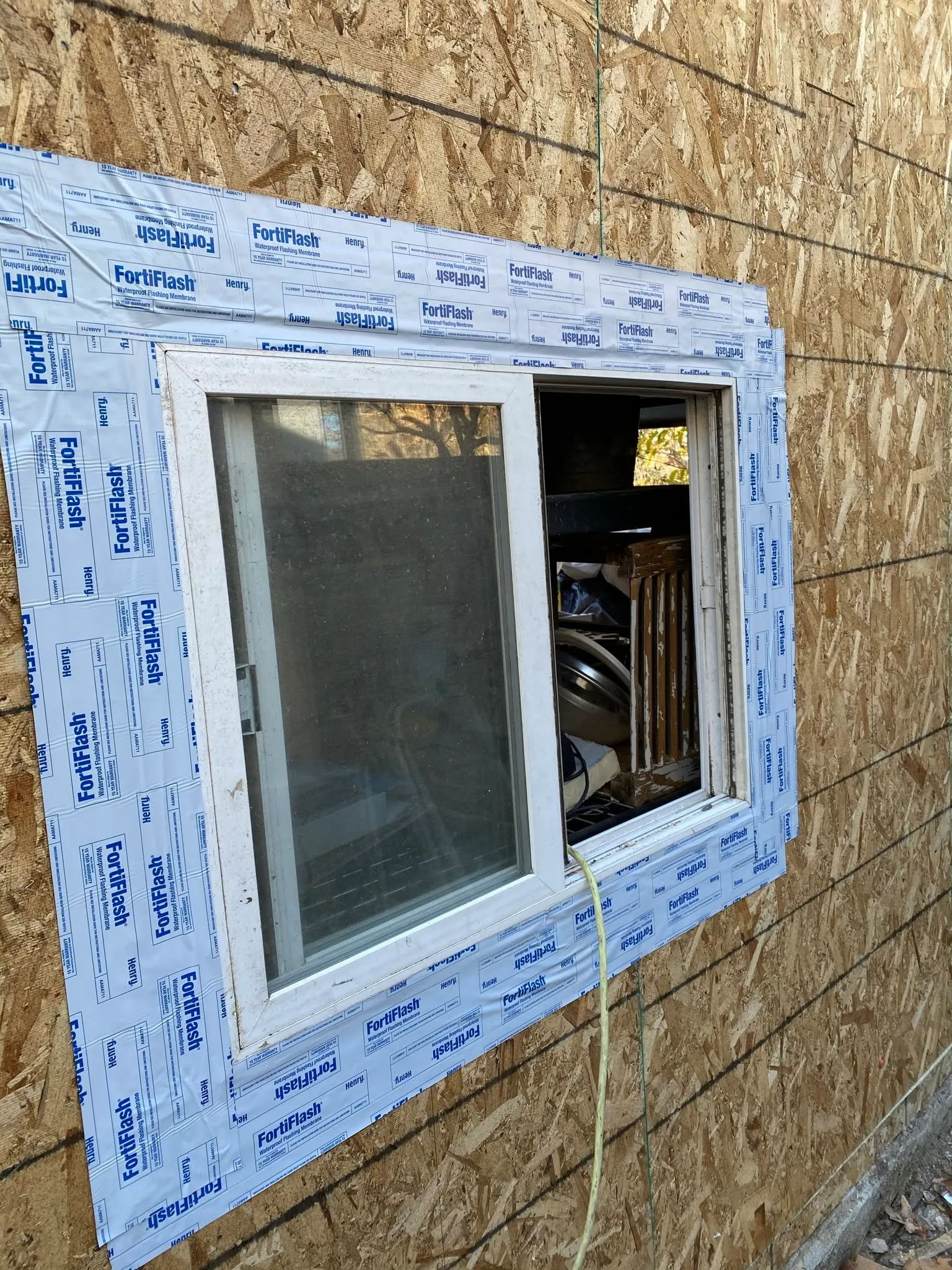Window flashing tape sealing a new window opening in Vallejo