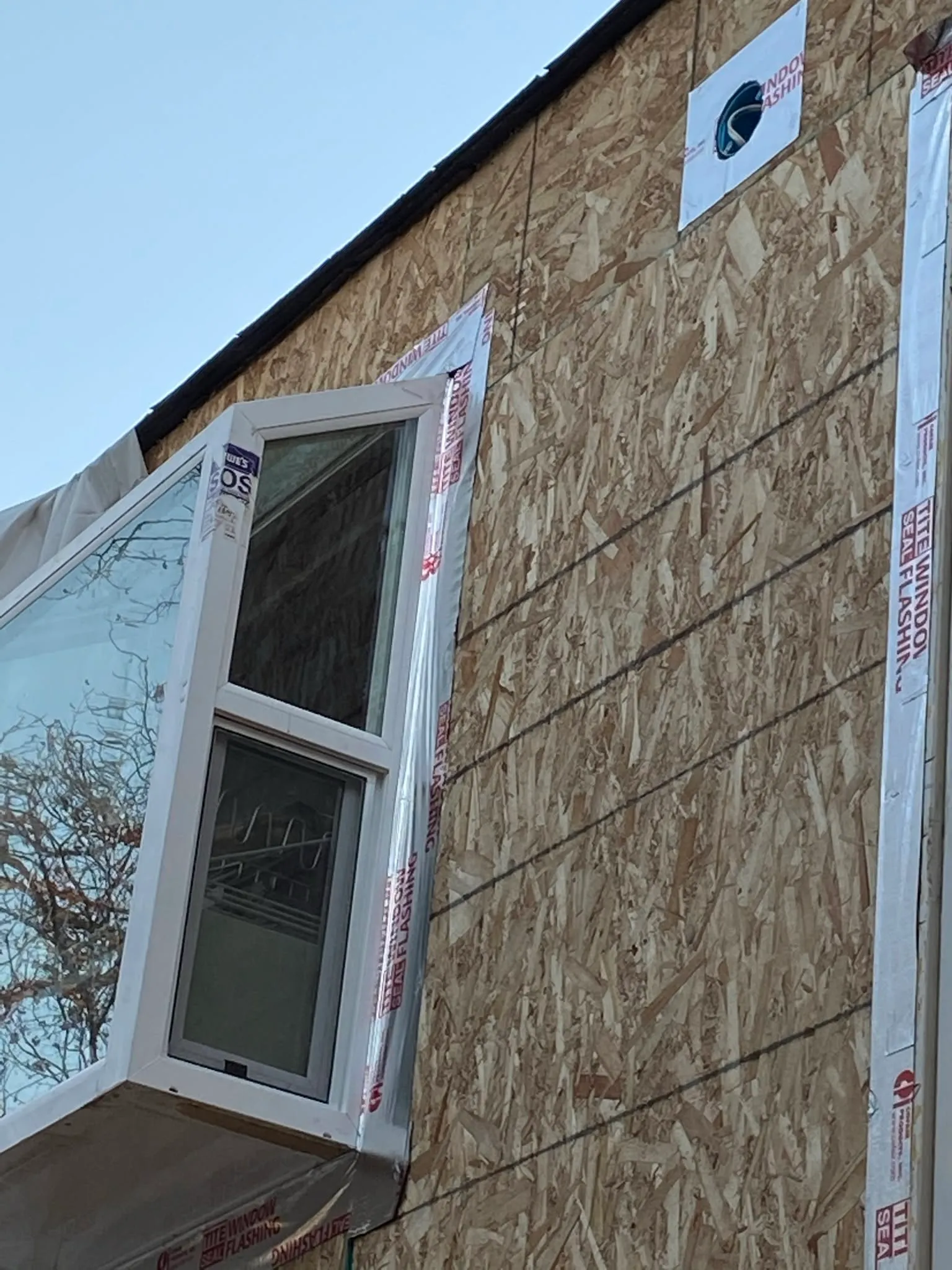 New window set in OSB sheathing with flashing in Vallejo