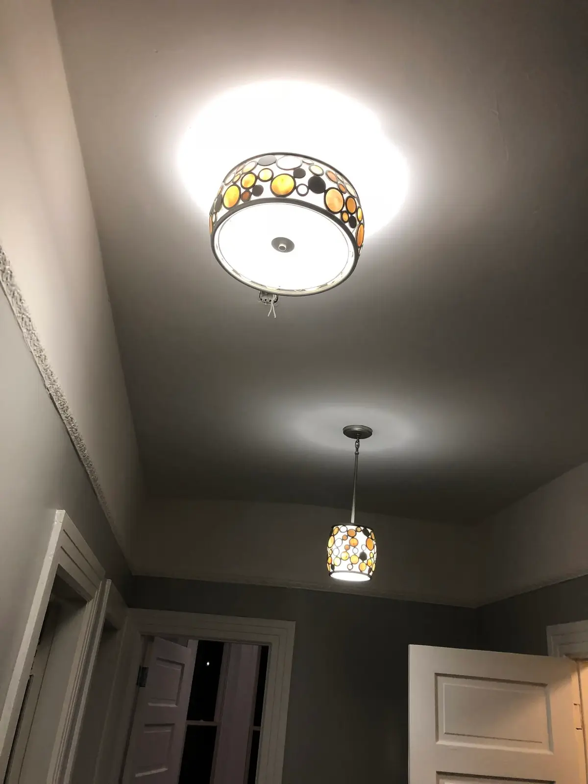 Interior painting in Vallejo: charcoal gray walls with a decorative ceiling fixture