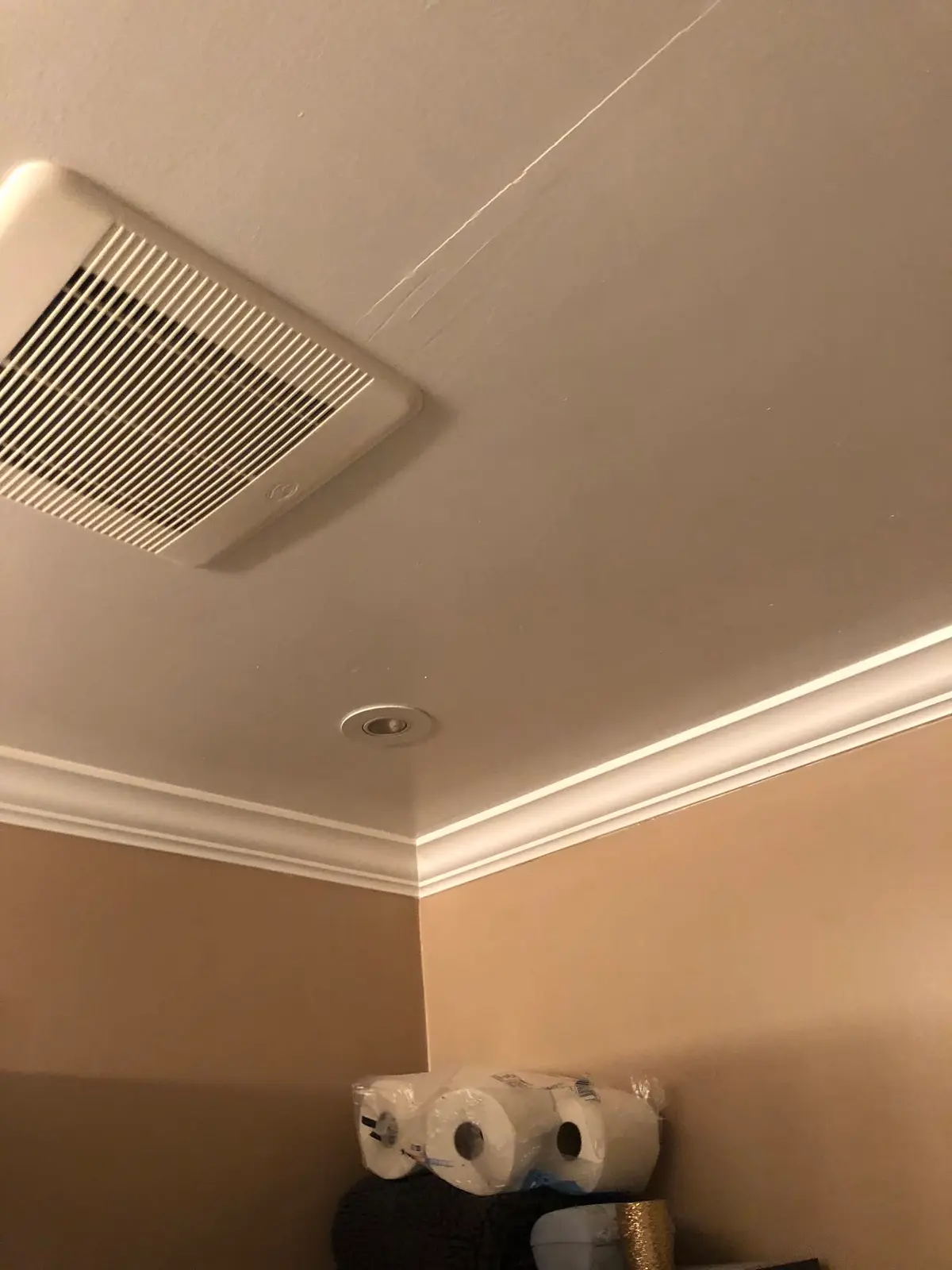 Electrician in Vallejo: bath fan in a ceiling with crown molding