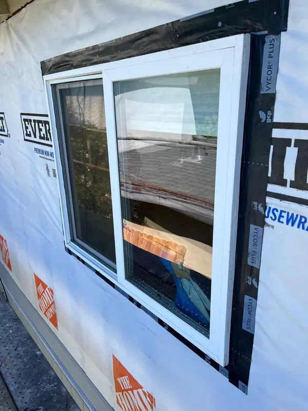Window installation in Vallejo: sliding window set in house wrap